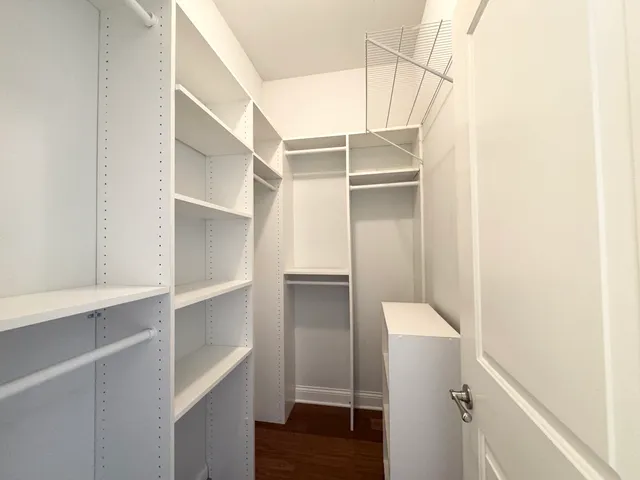 a view of an empty walk in closet