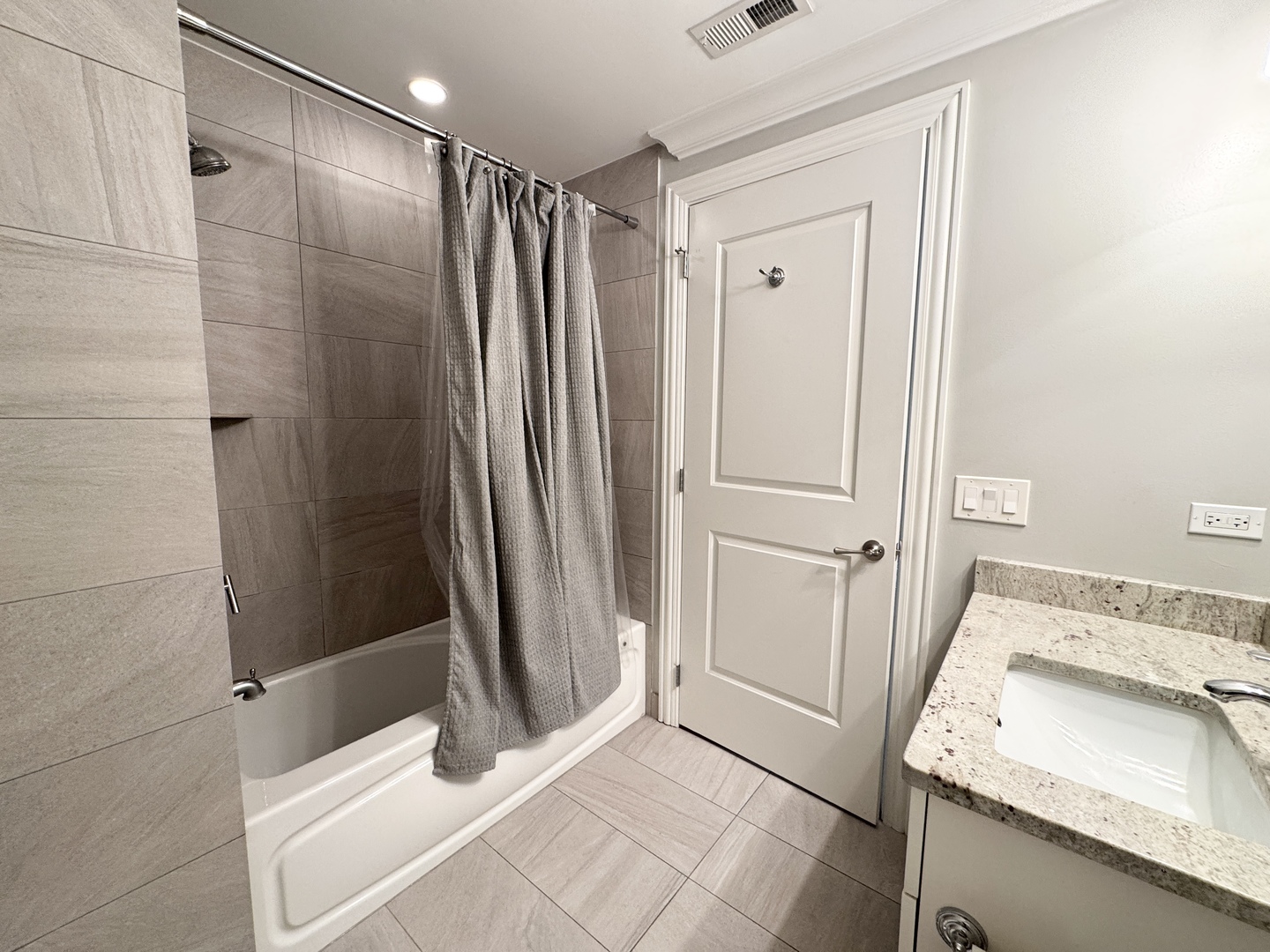 951 West Huron Street, Unit 402 Chicago, IL 60642 - Photo 17 of 18 a bathroom with a sink and a mirror