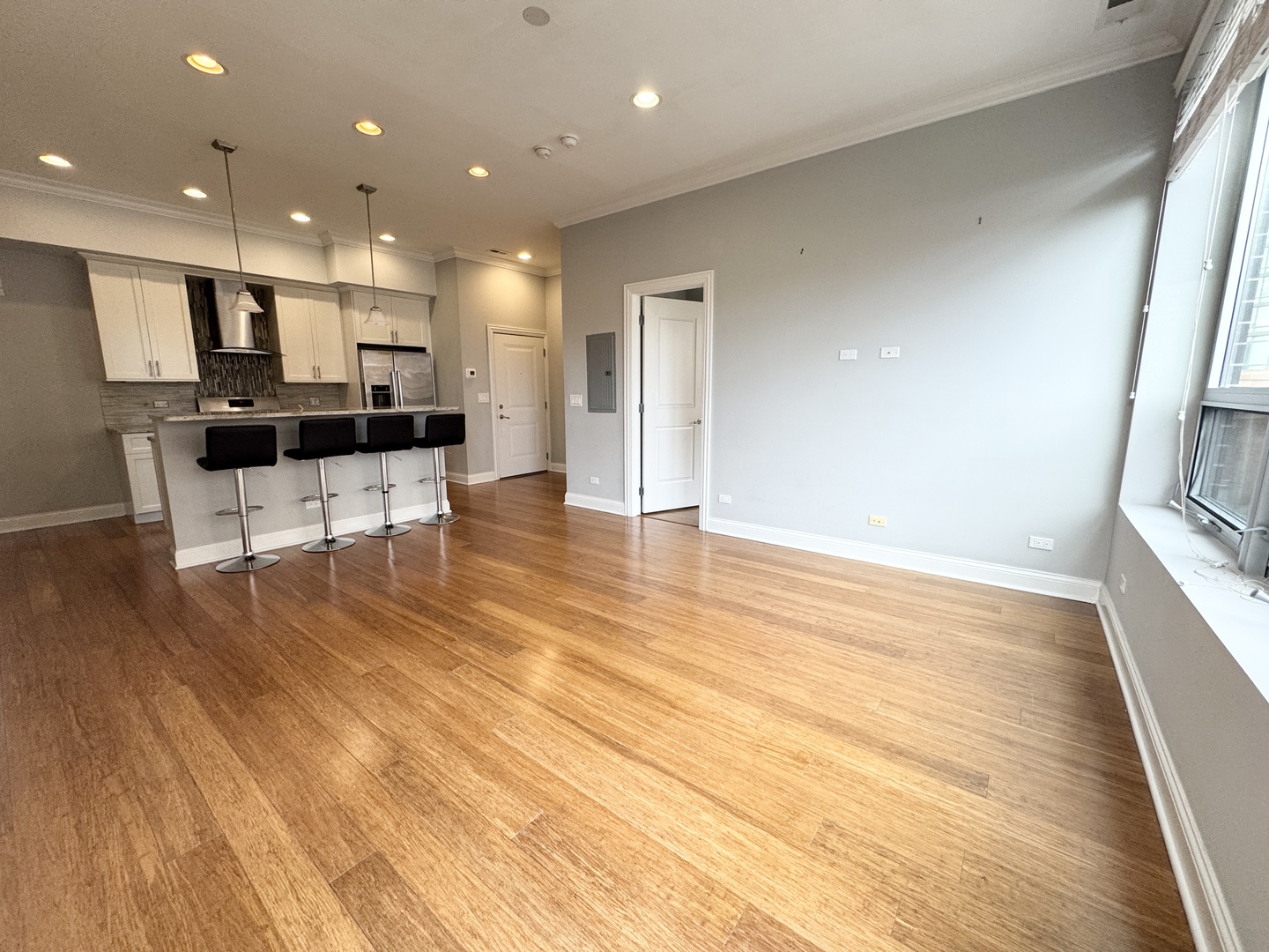 951 West Huron Street, Unit 402 Chicago, IL 60642 - Photo 7 of 18 a view of kitchen with cabinets and wooden floor