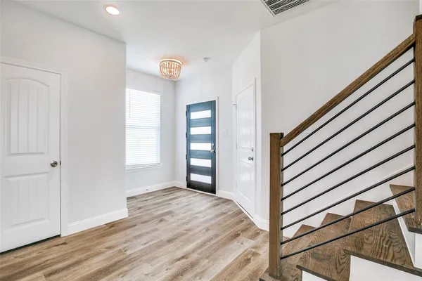 a view of a livingroom with wooden floor