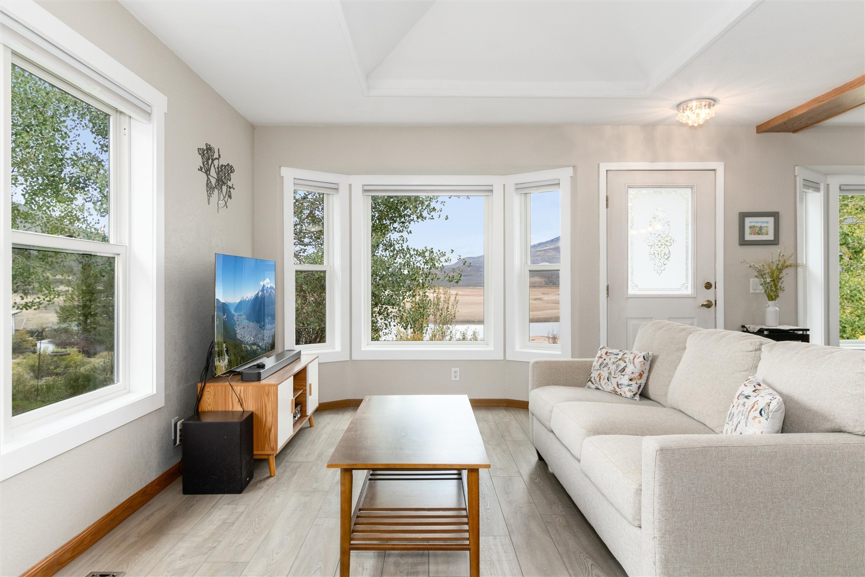 11 Blue Ridge Street Heeney, CO 80498 - Photo 17 of 45 The bright bay window frames gorgeous views of the lake from the open concept living room.