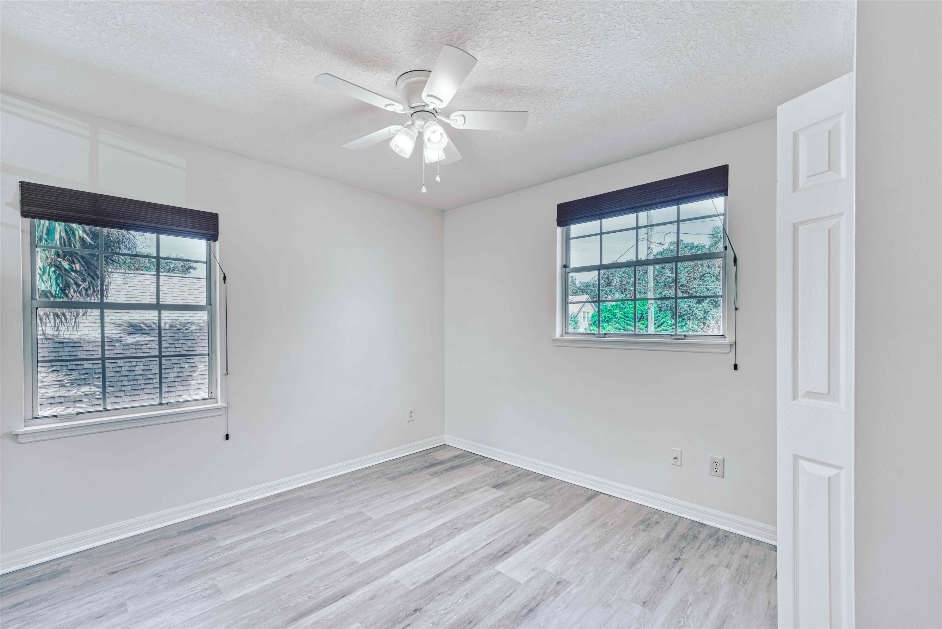 303 D Street St. Augustine, FL 32080 - Photo 27 of 35 wooden floor in an empty room with a window