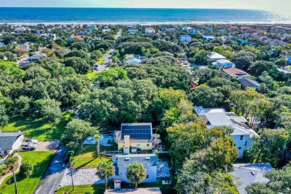 an aerial view of a house with a garden