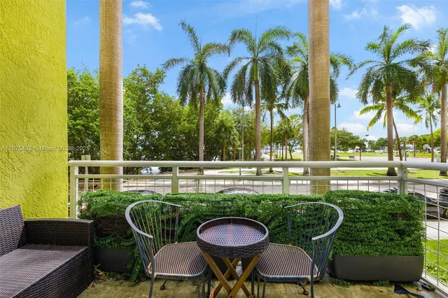 a view of a chairs and table in the patio