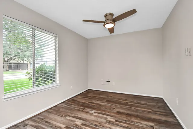 a view of a room with a large window