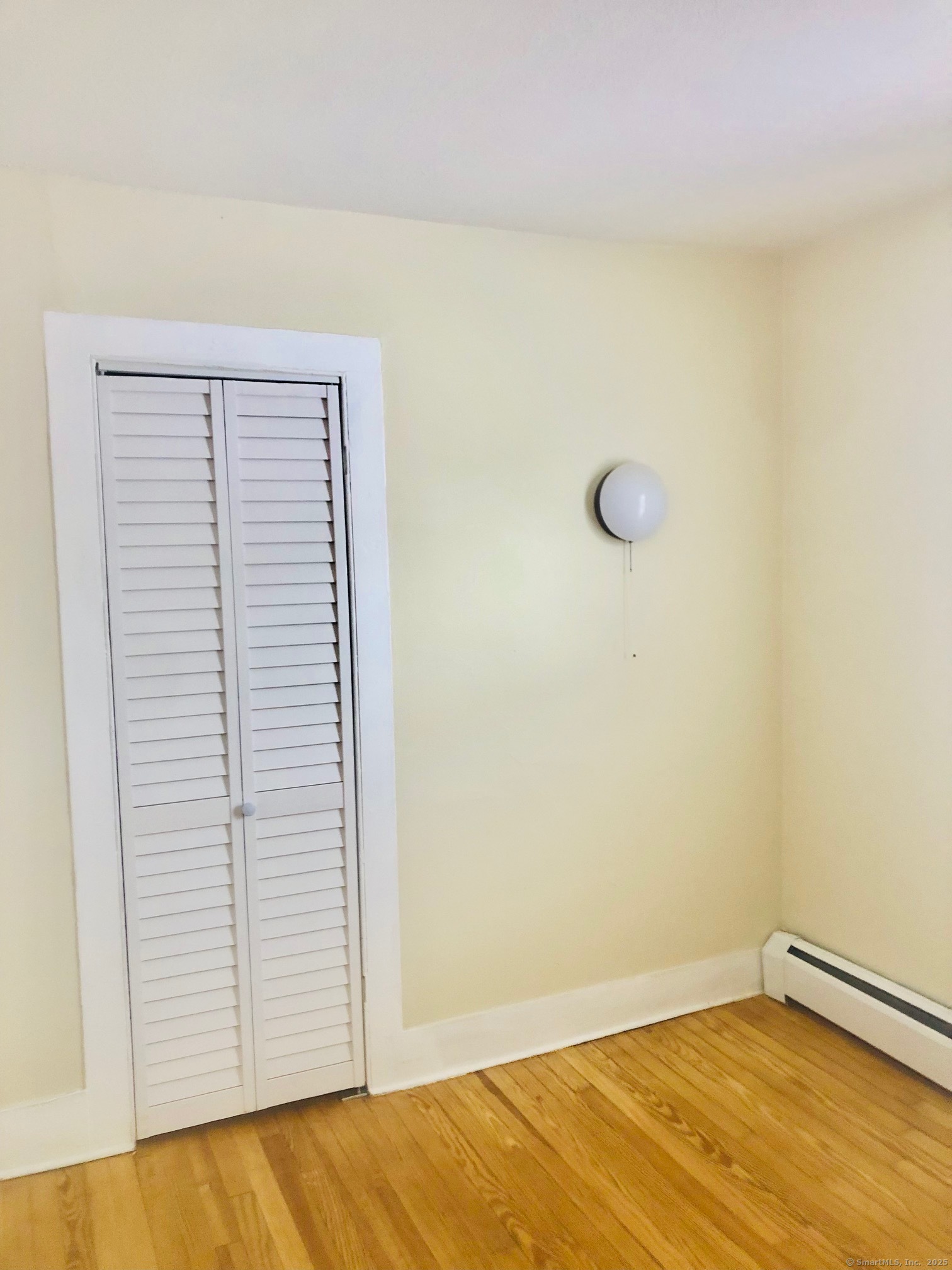 13 Tomlinson Street Ansonia, CT 06401 - Photo 17 of 21 a view of a room with rack on the wall