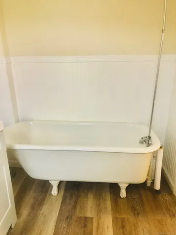 a bathroom with a bathtub and shower