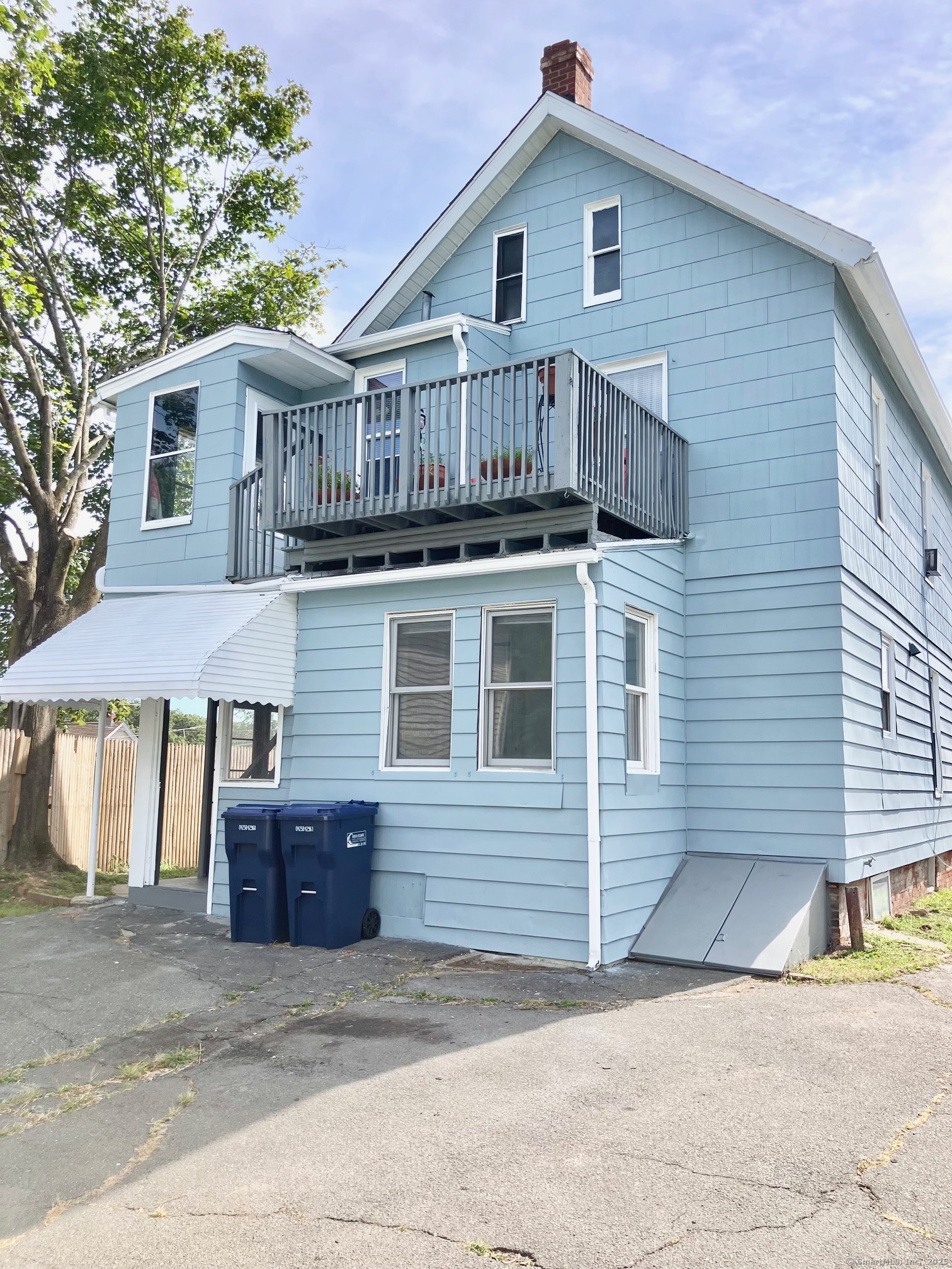 13 Tomlinson Street Ansonia, CT 06401 - Photo 2 of 21 a view of a house with wooden fence