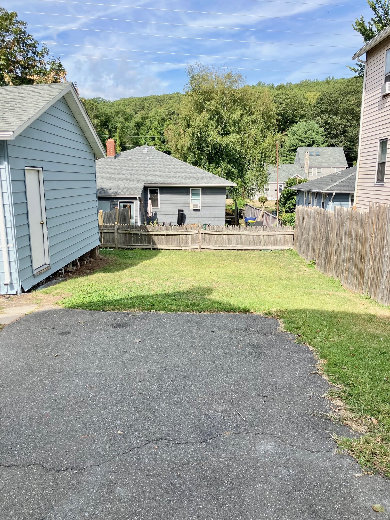 13 Tomlinson Street Ansonia, CT 06401 - Photo 3 of 21 a view of a house with a yard and a patio