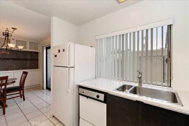 a kitchen with a sink a refrigerator and a sink