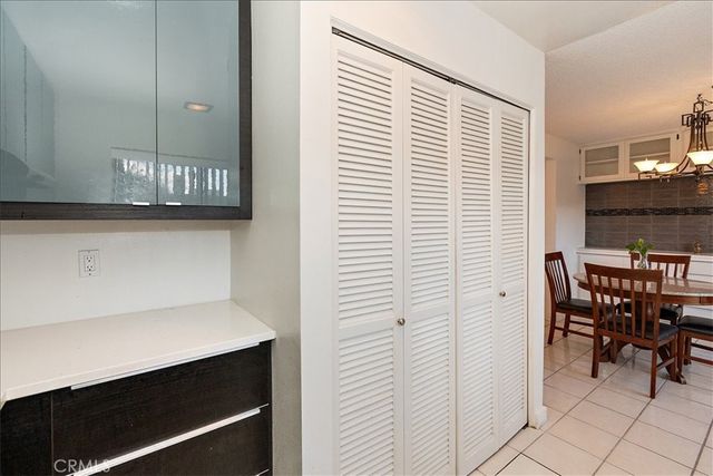 a view of a dining room with furniture and a window