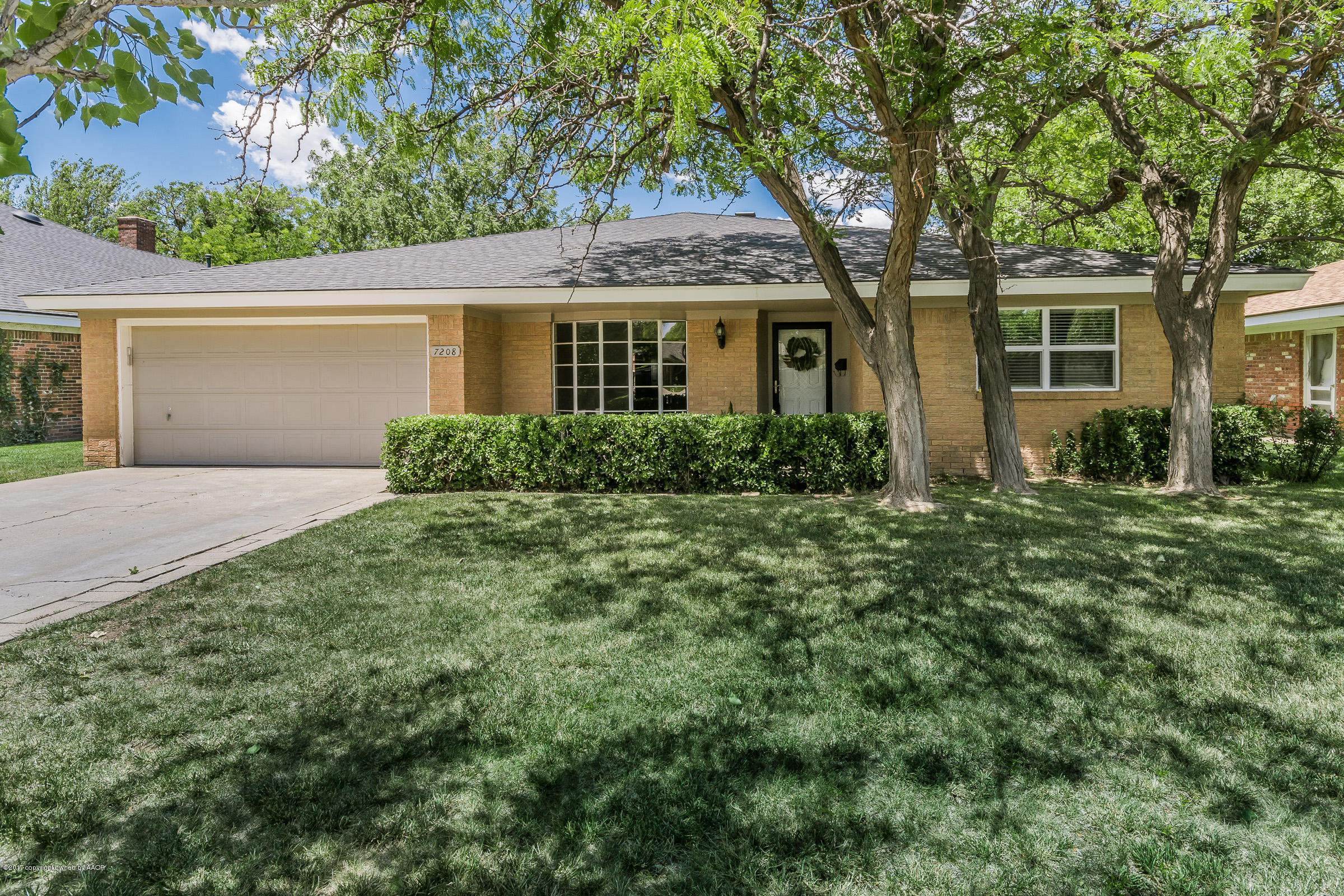 7208 Calumet Road Amarillo, TX 79106 - Photo 2 of 22 front view of a house with a yard