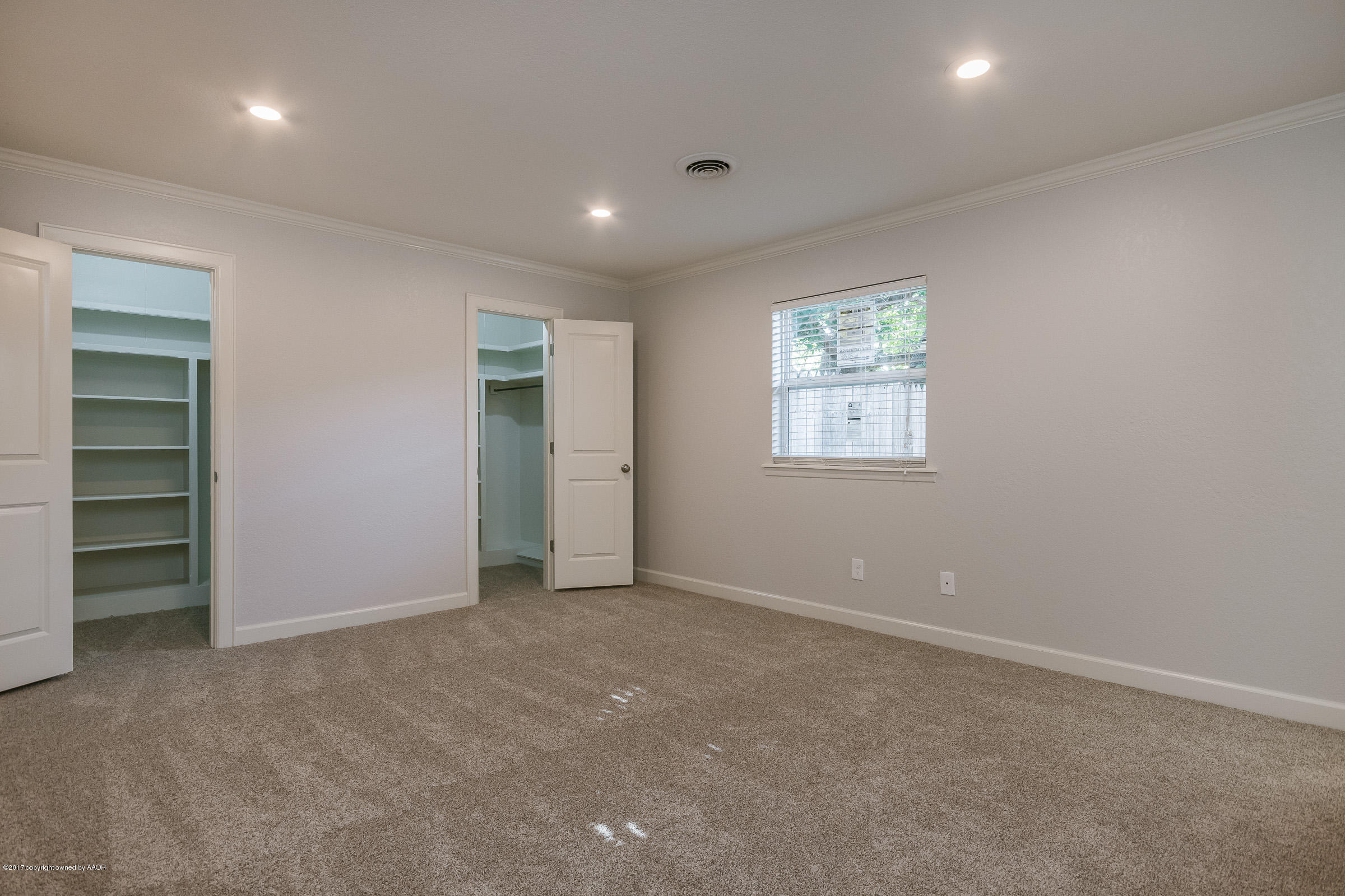 7208 Calumet Road Amarillo, TX 79106 - Photo 14 of 22 an empty room with closet and windows