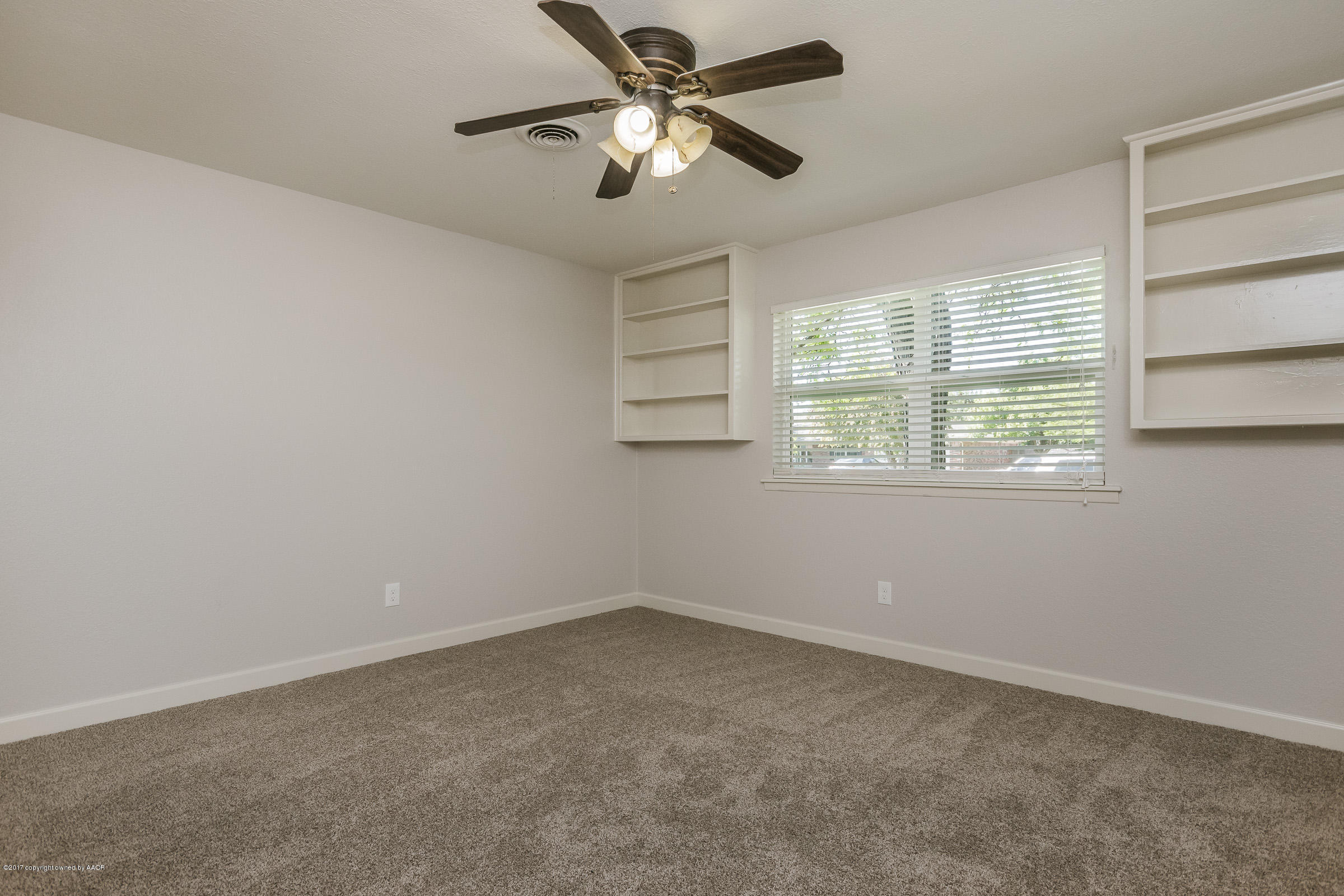 7208 Calumet Road Amarillo, TX 79106 - Photo 16 of 22 a view of an empty room with a window
