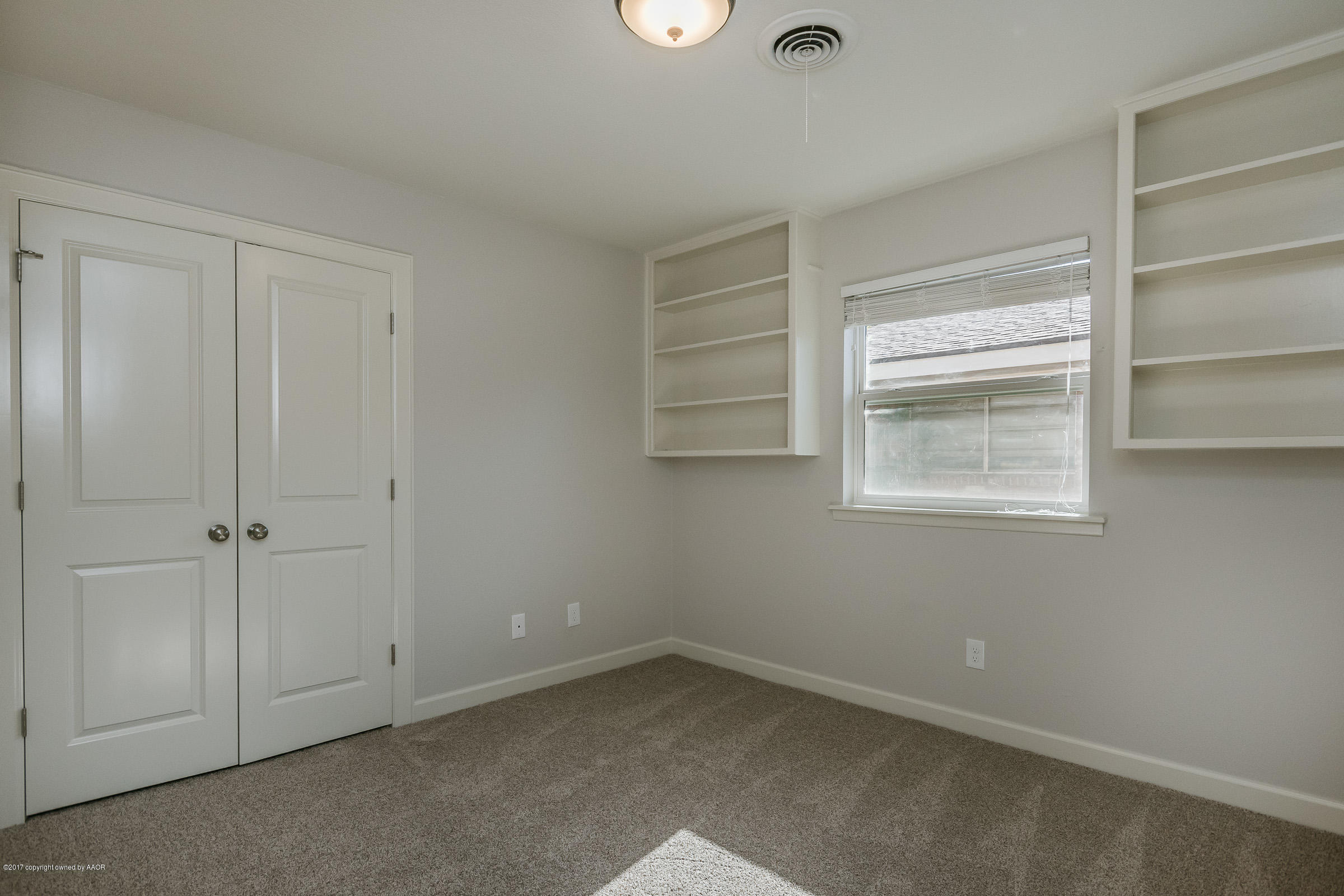 7208 Calumet Road Amarillo, TX 79106 - Photo 18 of 22 a view of an empty room with a window