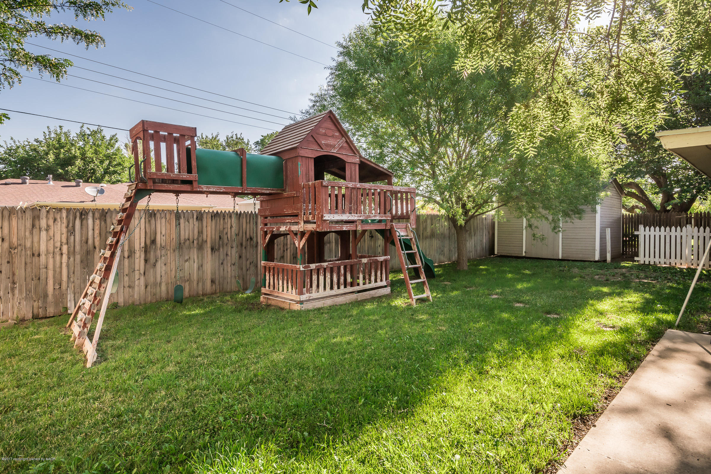 7208 Calumet Road Amarillo, TX 79106 - Photo 20 of 22 a view of a house with a yard and deck