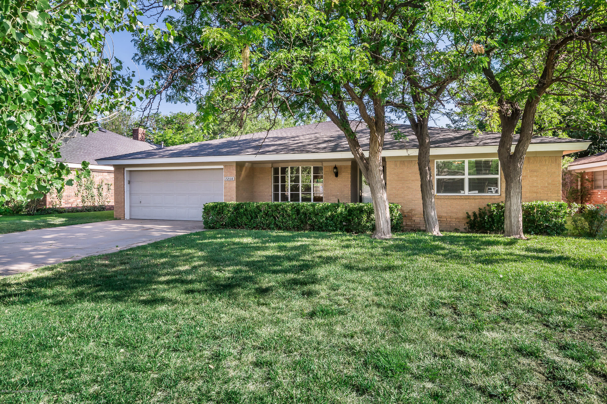 7208 Calumet Road Amarillo, TX 79106 - Photo 3 of 22 a front view of house with yard and green space