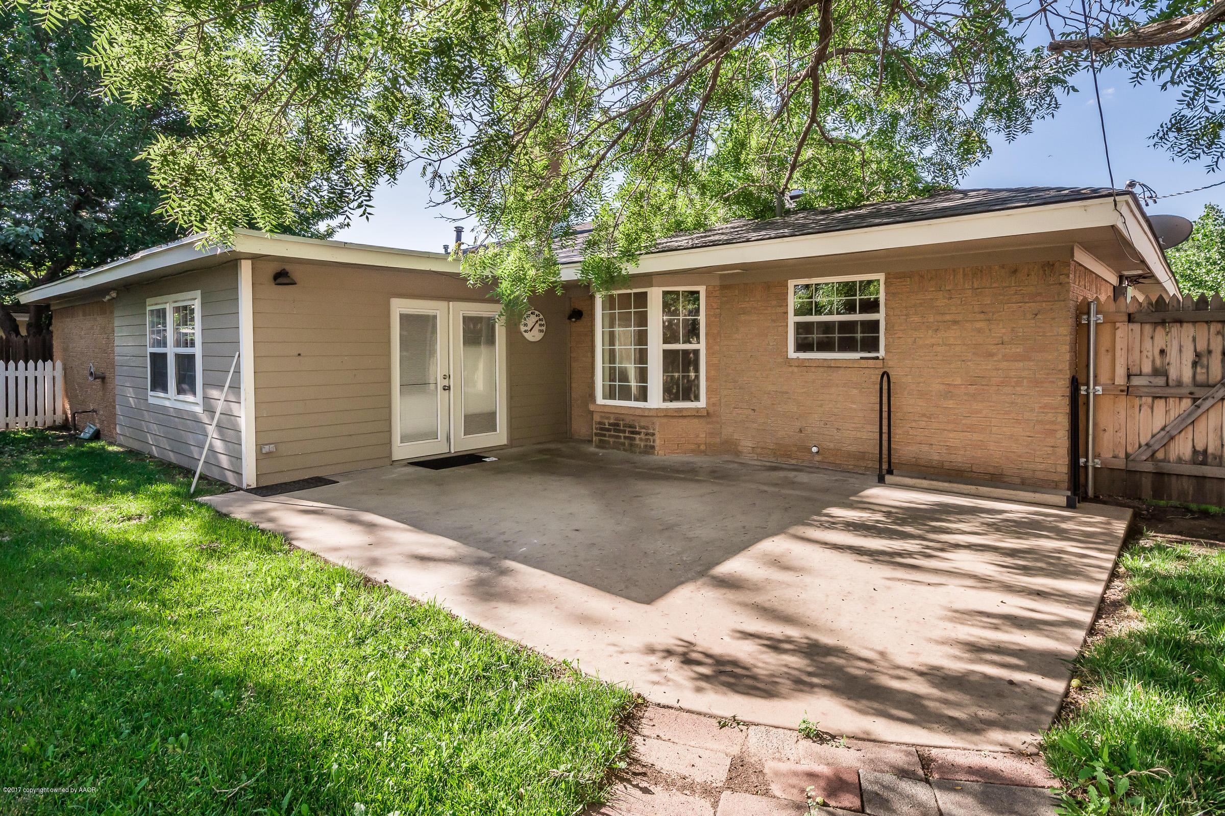 7208 Calumet Road Amarillo, TX 79106 - Photo 21 of 22 a view of a house with a yard