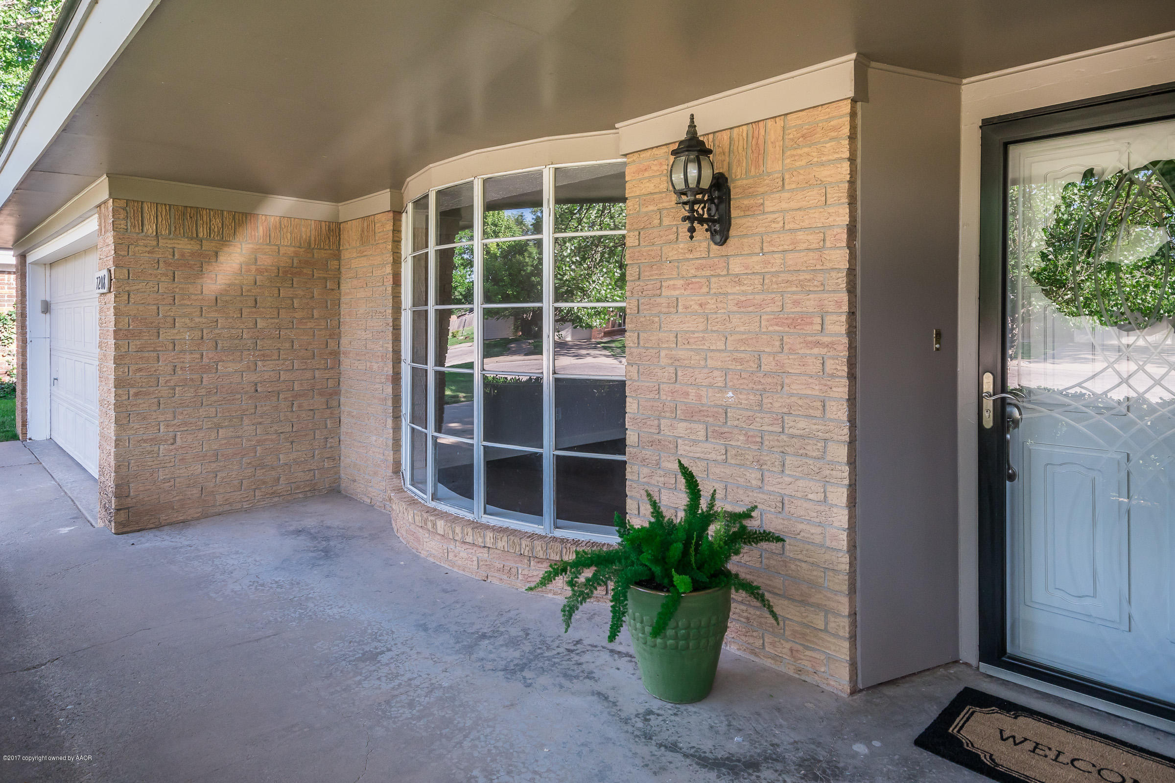 7208 Calumet Road Amarillo, TX 79106 - Photo 4 of 22 a view of front door and yard
