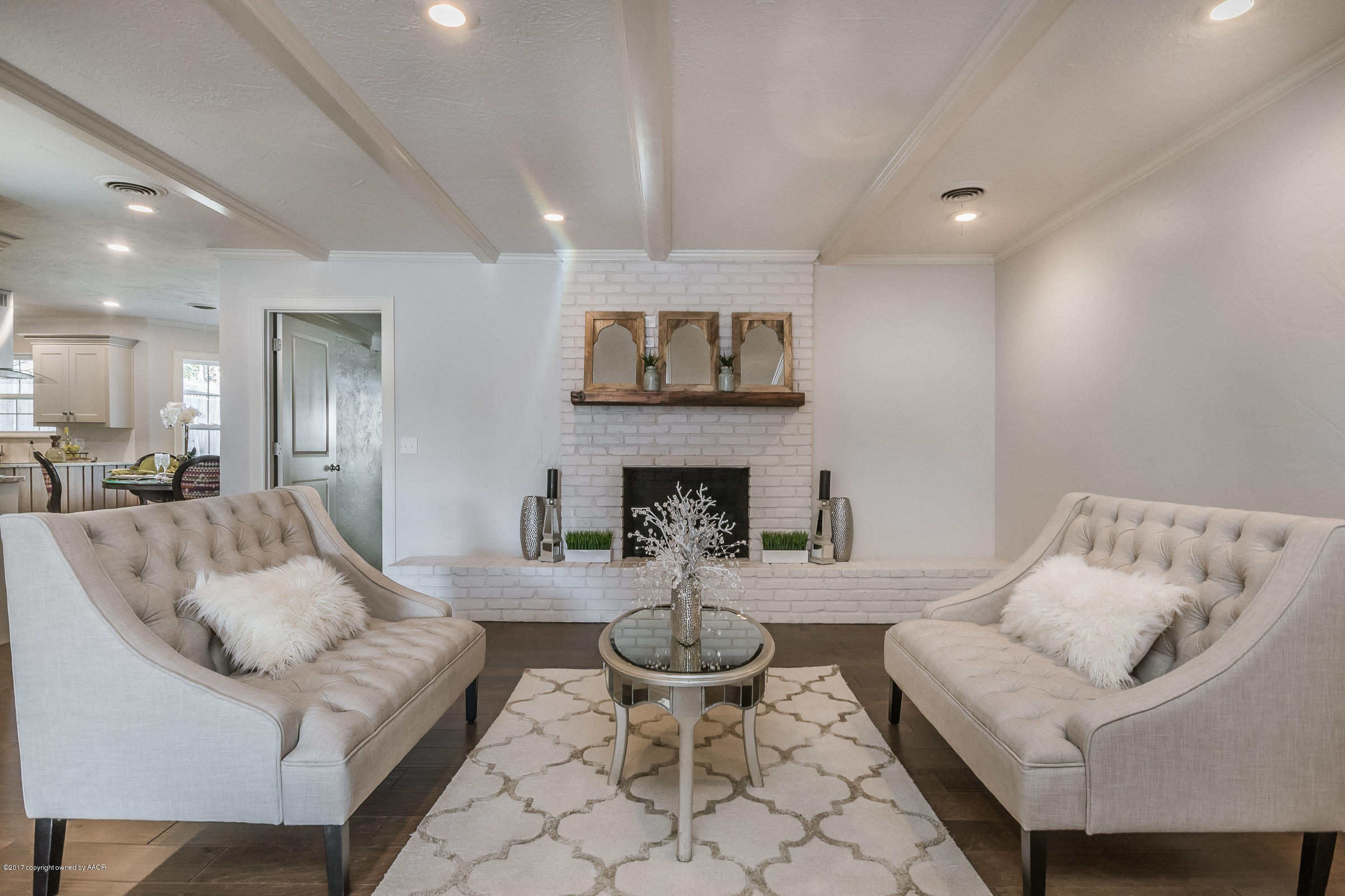 7208 Calumet Road Amarillo, TX 79106 - Photo 7 of 22 a living room with furniture and a fireplace