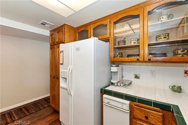 a white refrigerator freezer sitting inside of a kitchen
