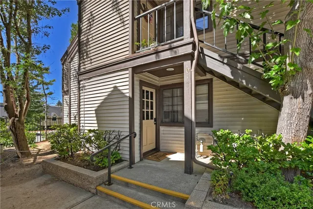 a view of a house with a flower garden