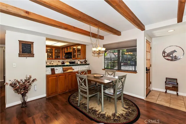 a dining room with furniture and wooden floor