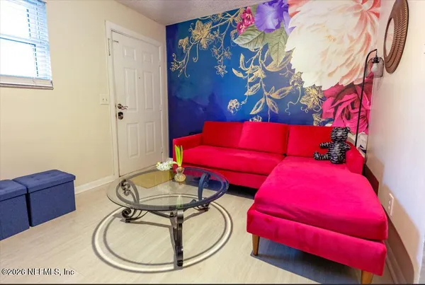 a room with furniture and wooden floor