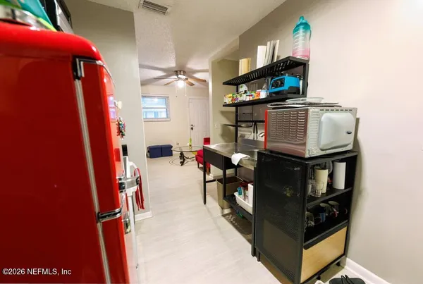 a view of living room with furniture and a flat screen tv