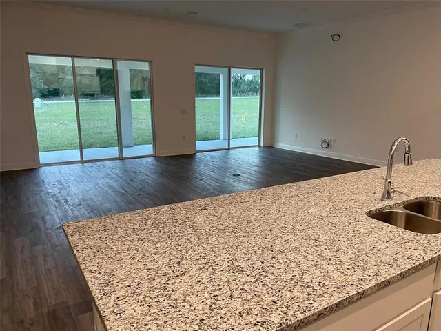 a kitchen with a sink and large window
