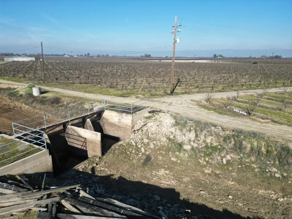 a view of a terrace with wooden floor and a lake view
