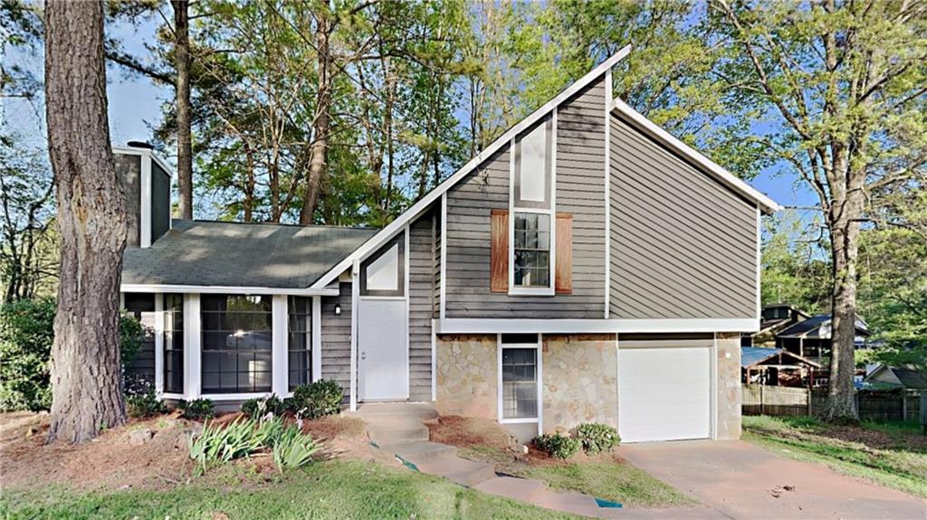 4170 Little Springs Road Kennesaw, GA 30144 - Photo 1 of 1 a front view of a house with garden