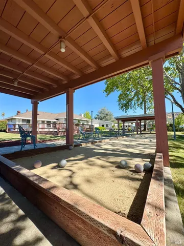 a view of swimming pool with outdoor seating