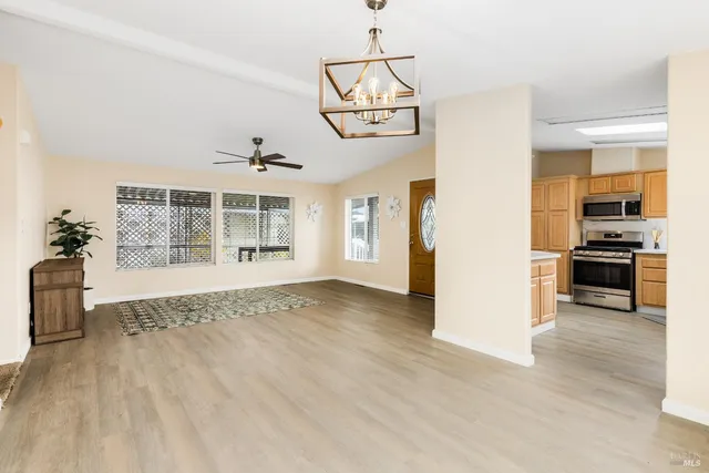 a view of a kitchen with furniture and a window