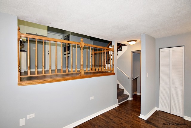309 Hopi Court Carol Stream, IL 60188 - Photo 12 of 25 a view of entryway with wooden floor and stairs