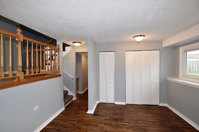 309 Hopi Court Carol Stream, IL 60188 - Photo 13 of 25 a view of entryway with wooden floor and stairs