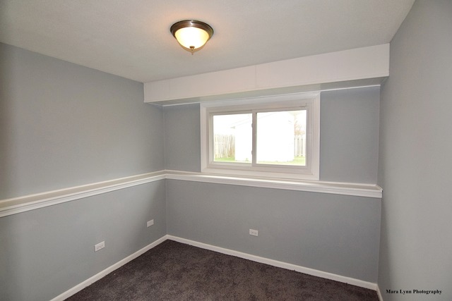 309 Hopi Court Carol Stream, IL 60188 - Photo 15 of 25 an empty room with a window