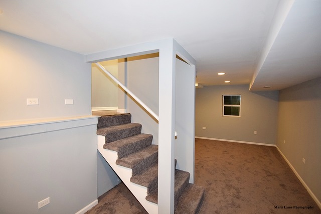 309 Hopi Court Carol Stream, IL 60188 - Photo 16 of 25 a view of entryway and hall with wooden floor