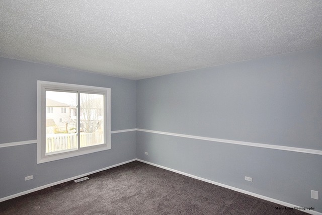 309 Hopi Court Carol Stream, IL 60188 - Photo 23 of 25 an empty room with a window