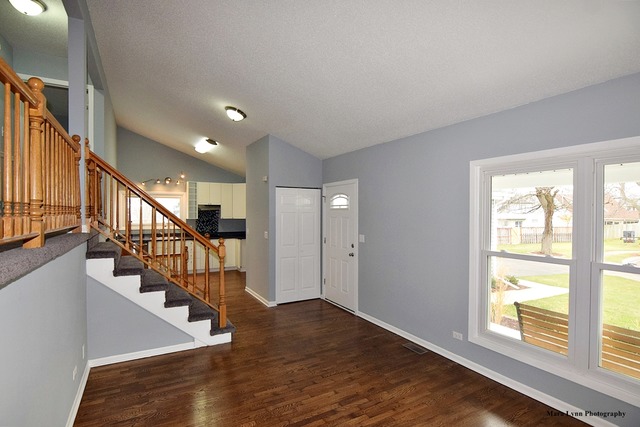 309 Hopi Court Carol Stream, IL 60188 - Photo 4 of 25 a view of entryway and hall with wooden floor