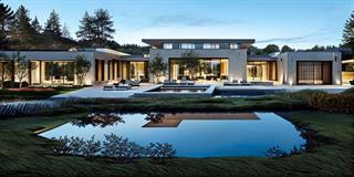 a view of a house with floor to yard and lake view
