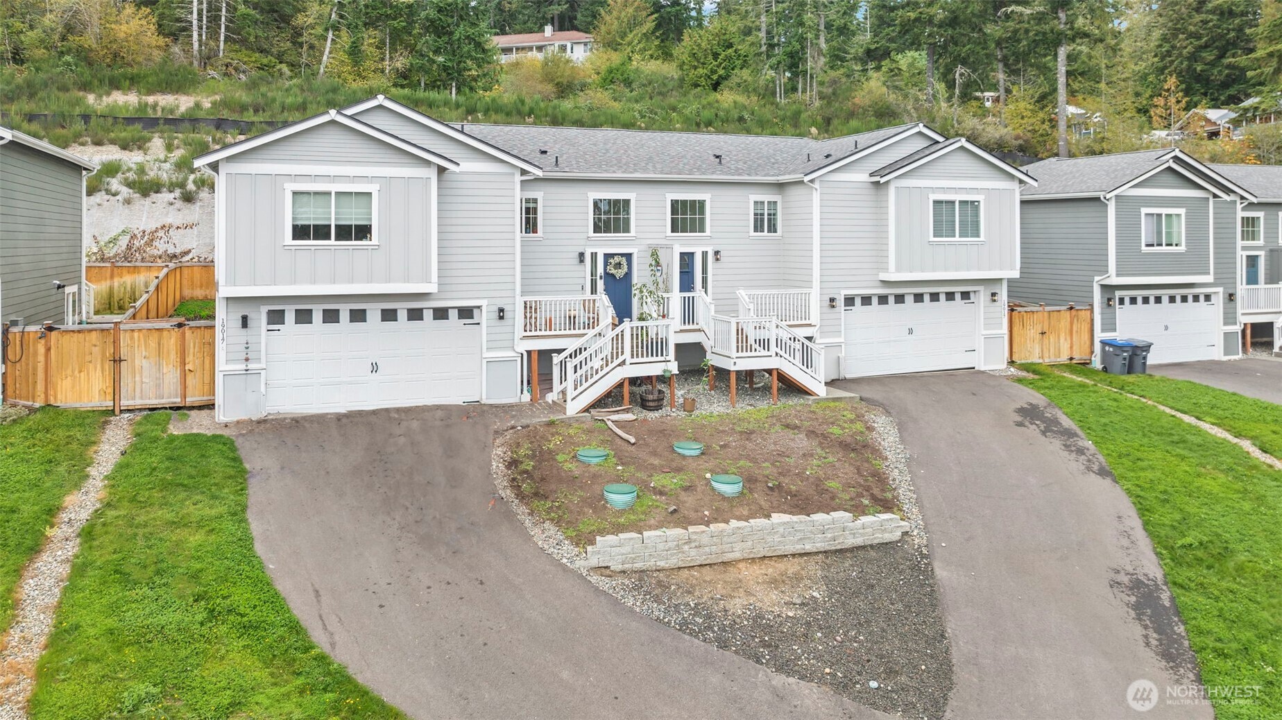 19017 Highway 3, Unit AB Allyn, WA 98524 - Photo 2 of 31 a view of a house with a yard and potted plants