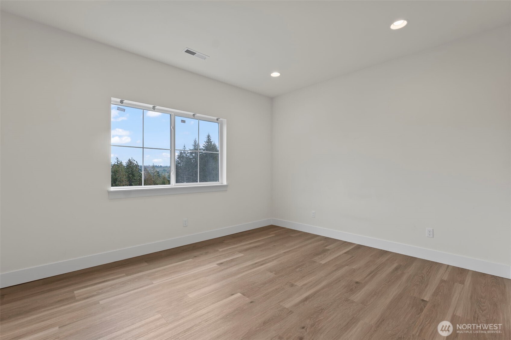 19017 Highway 3, Unit AB Allyn, WA 98524 - Photo 28 of 31 wooden floor in an empty room with a window