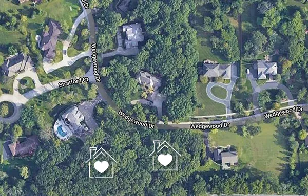 an aerial view of a house outdoor space and street view