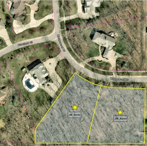 an aerial view of a house with a swimming pool