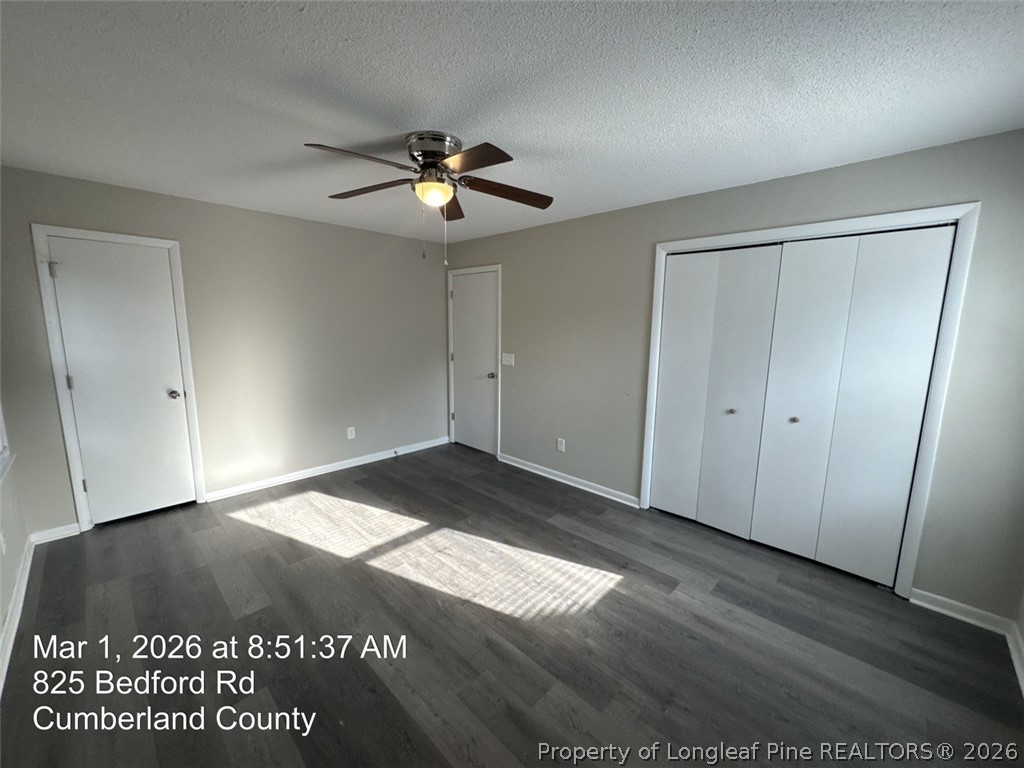 825 Bedford Road Fayetteville, NC 28303 - Photo 17 of 26 an empty room with wooden floor and chandelier fan