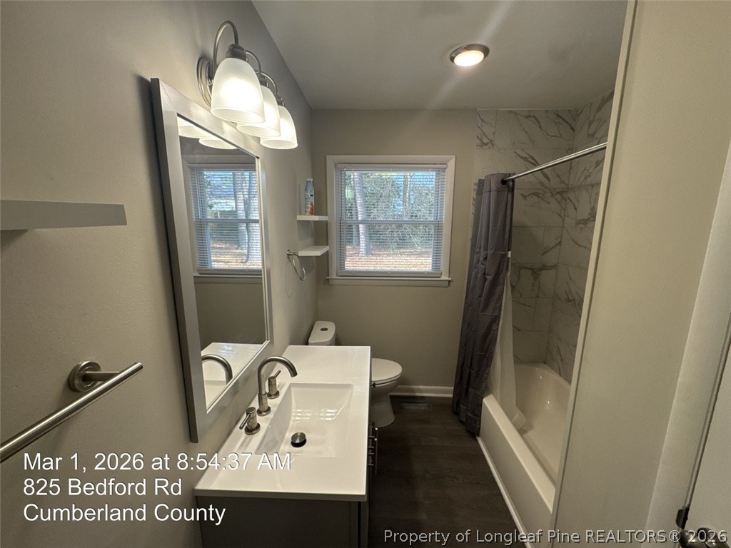825 Bedford Road Fayetteville, NC 28303 - Photo 26 of 26 a bathroom with a sink toilet and shower