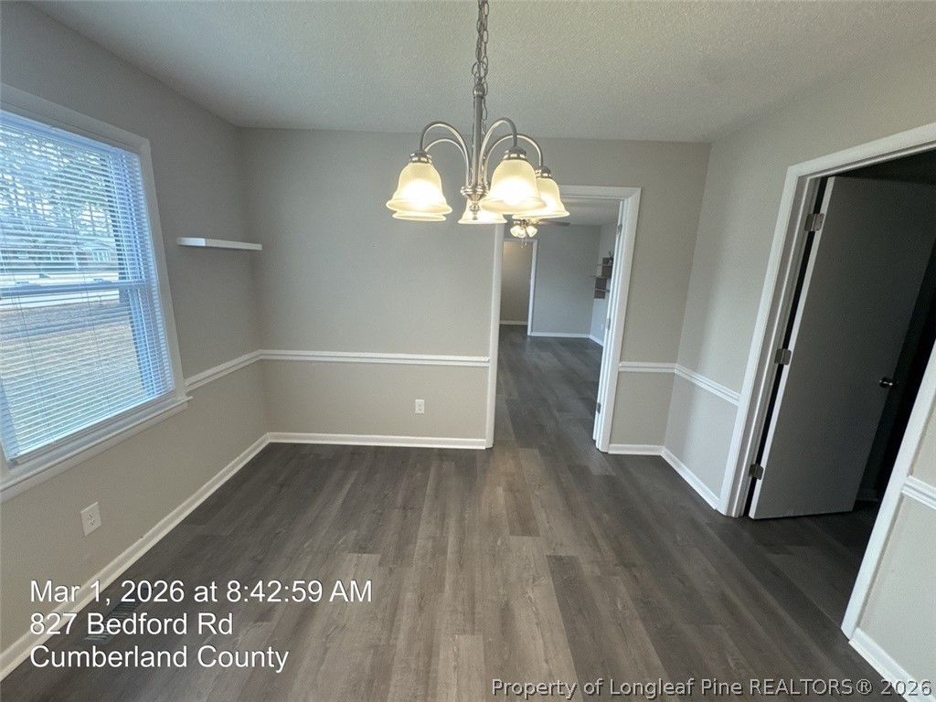 825 Bedford Road Fayetteville, NC 28303 - Photo 7 of 26 a view of a room with wooden floor and staircase