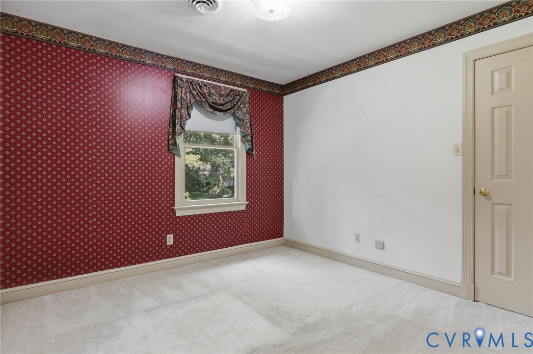 2311 Castle Hill Road Midlothian, VA 23113 - Photo 29 of 39 White paneled door with gold-finish hardware