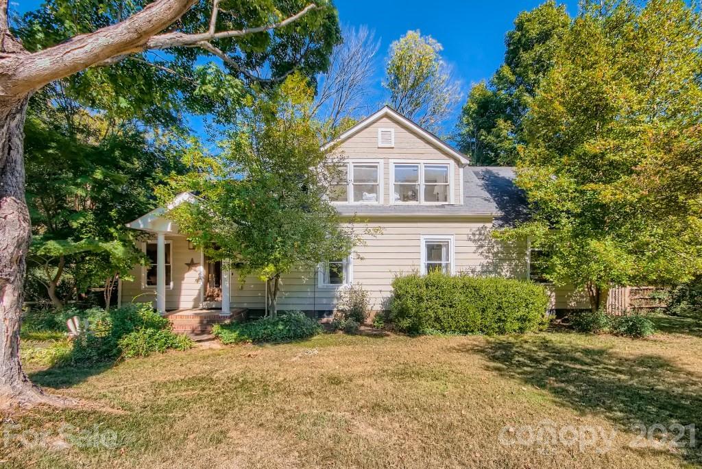 501 Marsh Road Charlotte, NC 28209 - Photo 2 of 27 a front view of a house with a yard and garage